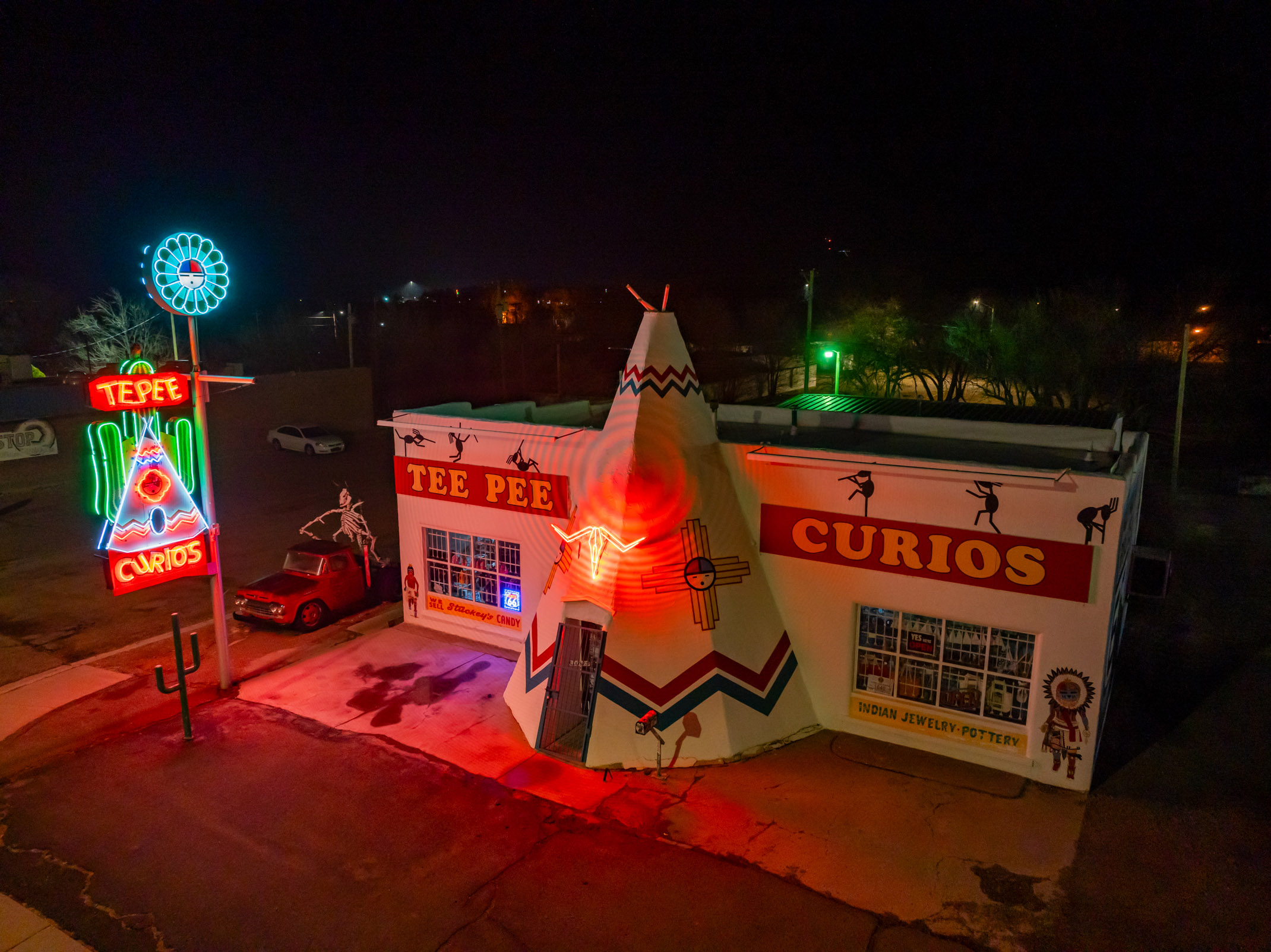 Neon signs illuminate the exterior of Tee Pee Curios in Tucumcari Neon signs illuminate the exterior of Tee Pee Curios in Tucumcari
