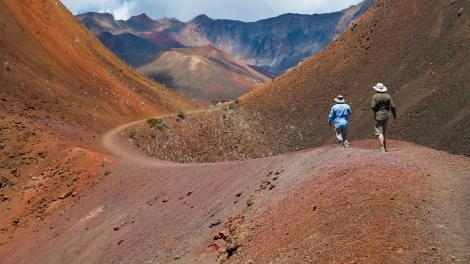 Hiking the cinder desert landscape of the Haleakalā Crater at the active volcano