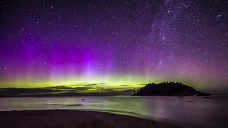 The aurora borealis, or northern lights, glowing over Little Presque Isle
