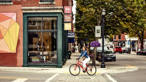 Bike rider seeing the sights in small-town Biddeford, Maine Bike rider seeing the sights in small-town Biddeford, Maine