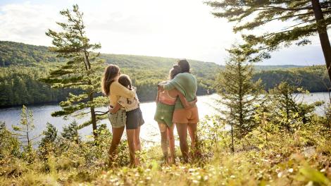Travelers basking in the natural beauty of The Forks in Maine Travelers basking in the natural beauty of The Forks in Maine