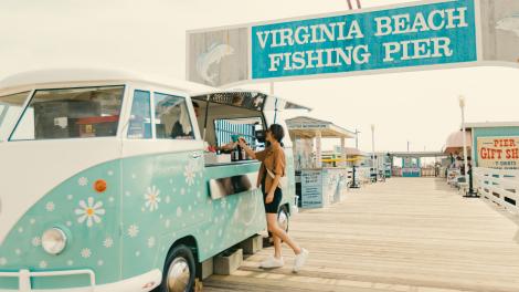 Colorful shops and food trucks line the Virginia Beach Fishing Pier in Virginia Beach, Virginia