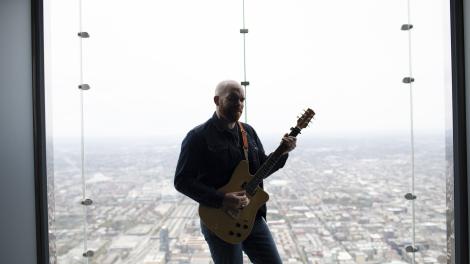 Mike Ledbetter playing the blues in a Chicago, Illinois, skyscraper Mike Ledbetter playing the blues in a Chicago, Illinois, skyscraper