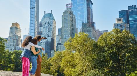 Visitors taking a selfie of the New York City, New York, skyline from Central Park