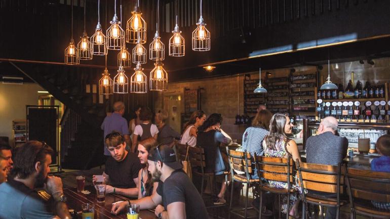 Relax on the intimate bar side of 3 Daughters Brewing, or wander into the brewery’s warehouse space for games and live music.