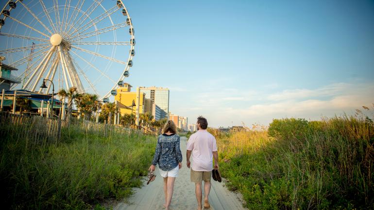 Walking the shores of Myrtle Beach, South Carolina, near the SkyWheel