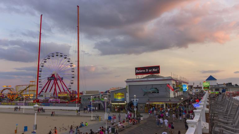 Stroll the bustling beachfront boardwalk of Ocean City, Maryland.