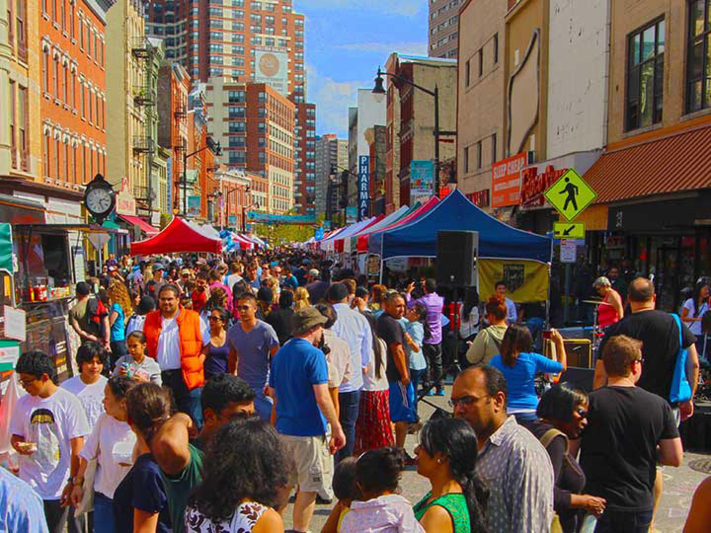 Strolling the booths at the All About Downtown Street Fair