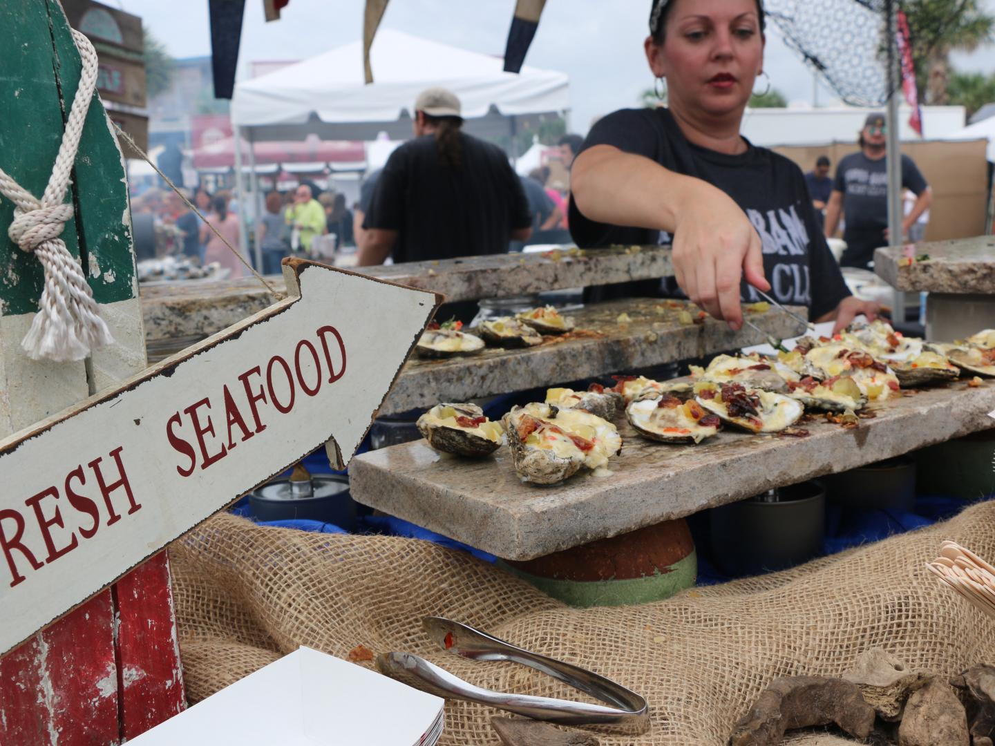 Preparing the main delicacy during the Oyster Cook-Off and Craft Beer Weekend in Gulf Shores, Alabama