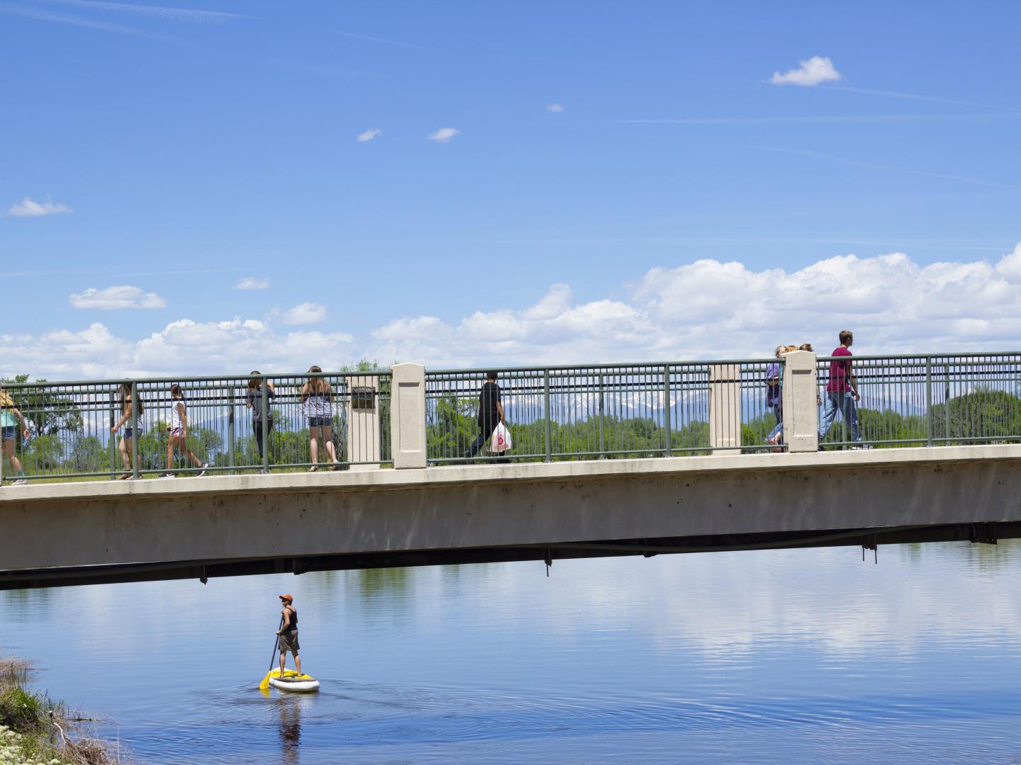 Sightseers overlooking the Rio Grande River during SummerFest on the Rio in Alamosa, Colorado