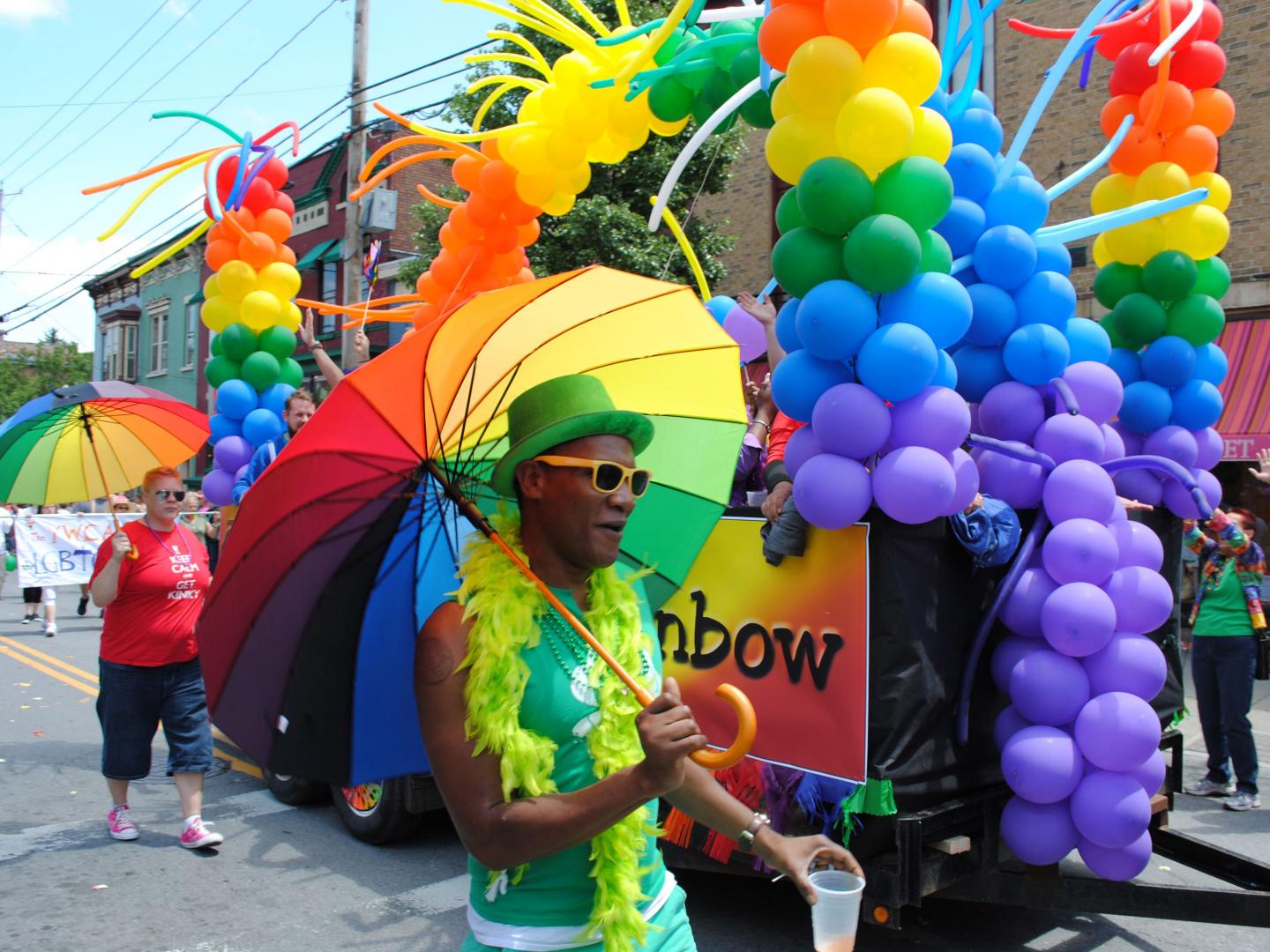 A colorful float and parade participants during the Capital Pride Parade & Festival in Albany, New York