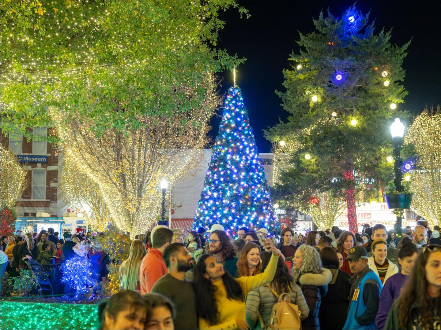 Festive crowds and holiday lights at the annual Lighting of the Square in Bentonville, Arkansas