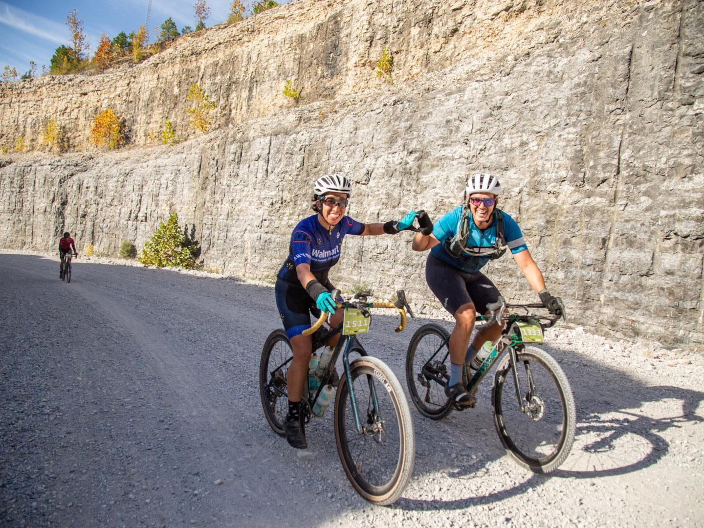 Cyclists pose for a photo while riding in the Life Time Big Sugar Classic in Bentonville, Arkansas