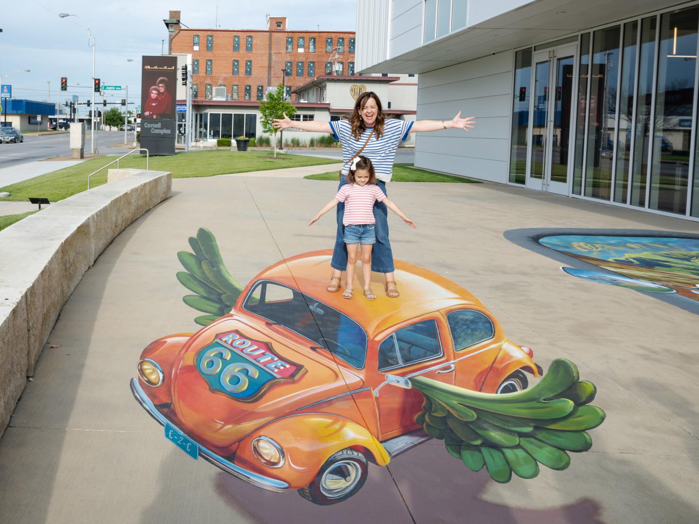 Posing with street art during the Route 66 World Street Painting Festival in Joplin, Missouri