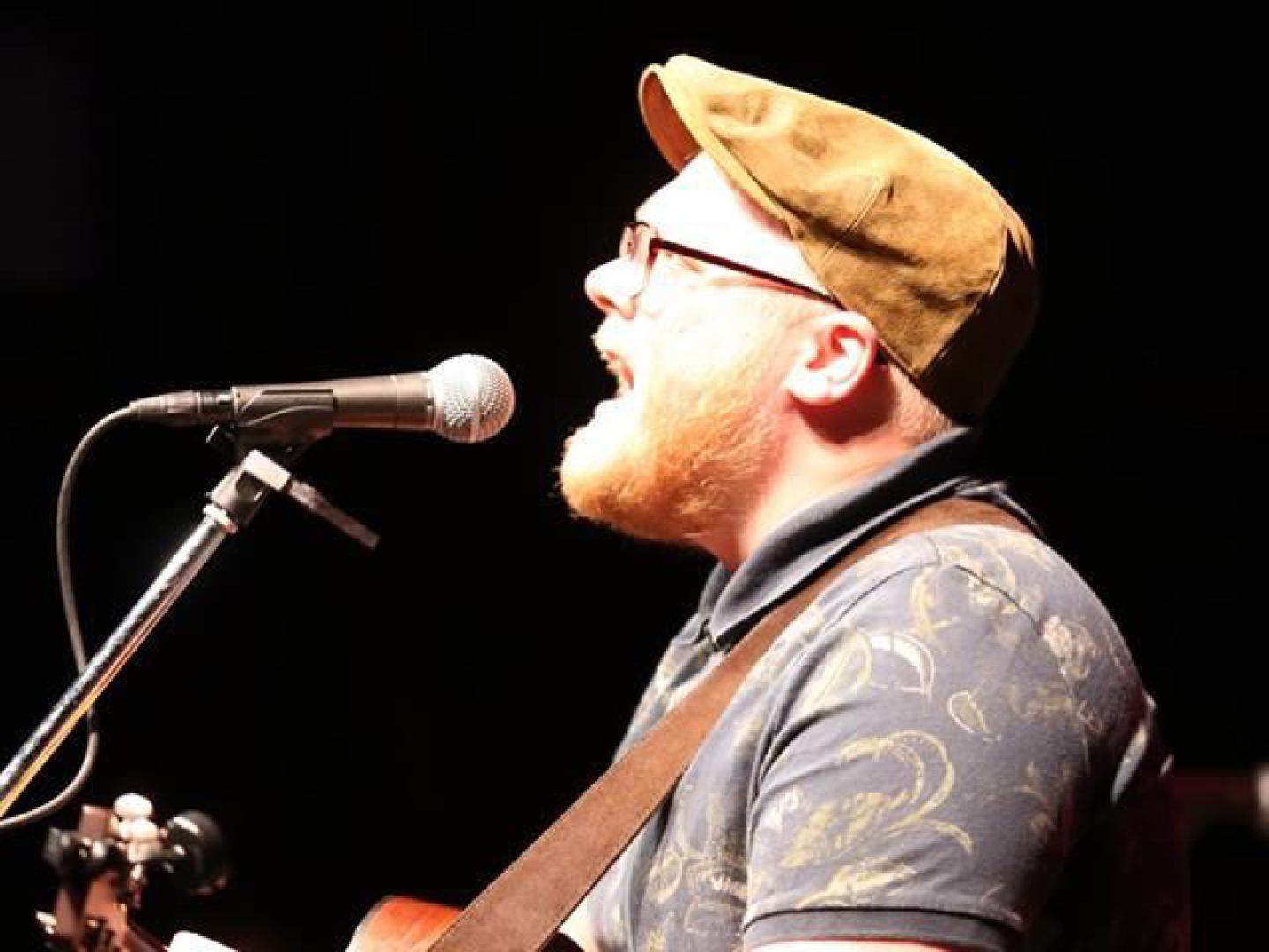 A musician performing during a Backstage Pass concert in Panama City, Florida