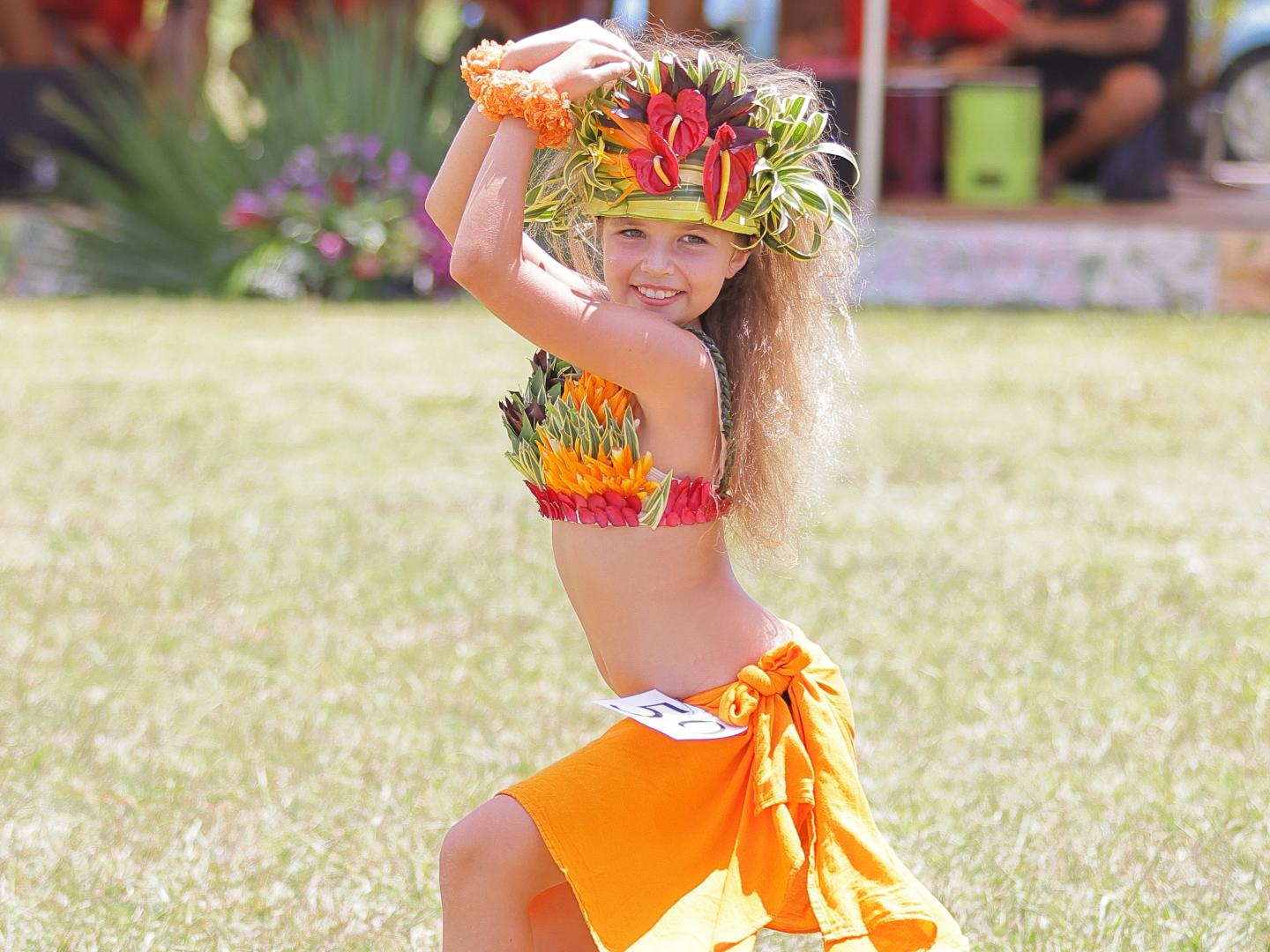 A young dancer celebrating Tahitian culture at the Heiva I Kauaʻi event in Kaua'i