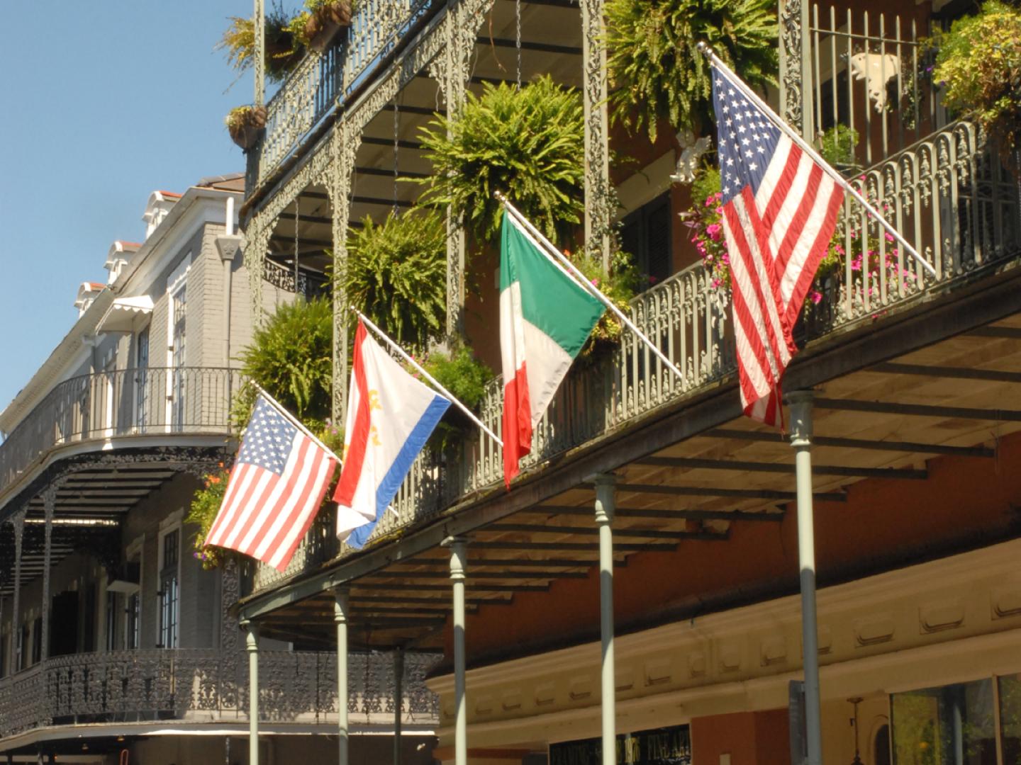 Flags hanging from the balconies in the French Quarter in New Orleans, Louisiana