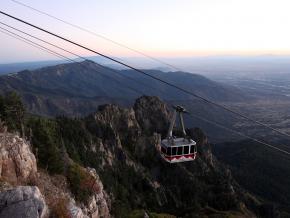 View of the Sandia Tram as it climbs up the steep mountainside View of the Sandia Tram as it climbs up the steep mountainside