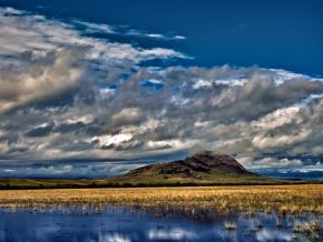 Bear Butte rising to meet the clouds Bear Butte rising to meet the clouds
