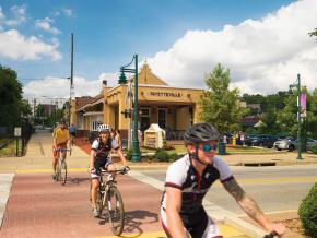 Cycling along the Razorback Regional Greenway through the heart of the city Cycling along the Razorback Regional Greenway through the heart of the city