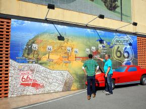 Admiring a Route 66 mural in Joplin, Missouri Admiring a Route 66 mural in Joplin, Missouri