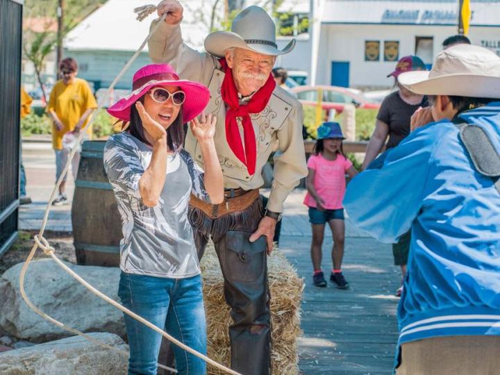Posing with a cowboy at the Santa Clarita Cowboy Festival in California