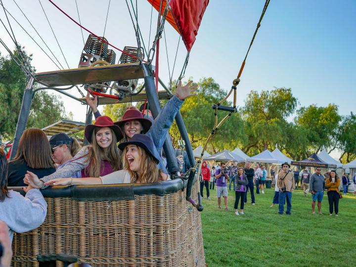 A hot air balloon getting ready to take off during the Temecula Valley Balloon & Wine Festival in California
