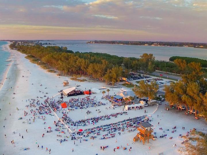 Aerial view of Symphony on the Sand, a live symphony performance on Coquina Beach, Florida
