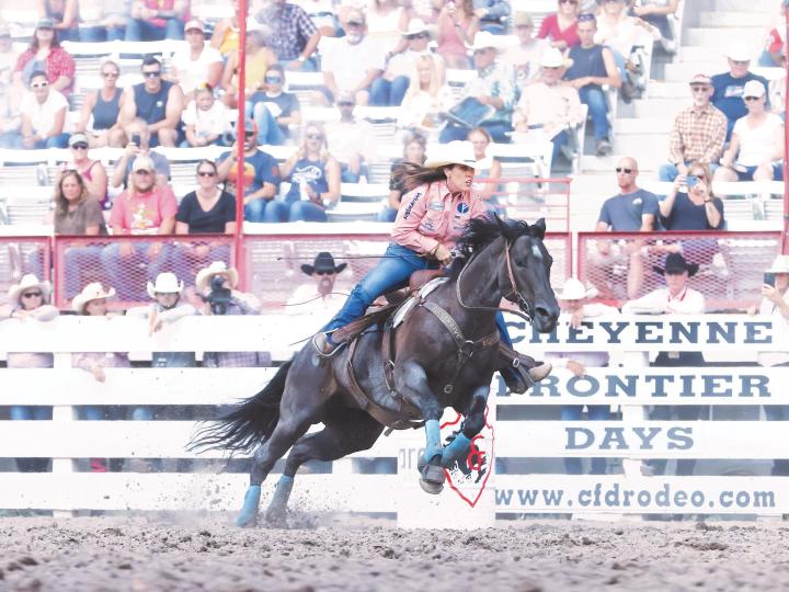 Barrel racing competition during the Cheyenne Frontier Days rodeo in Wyoming