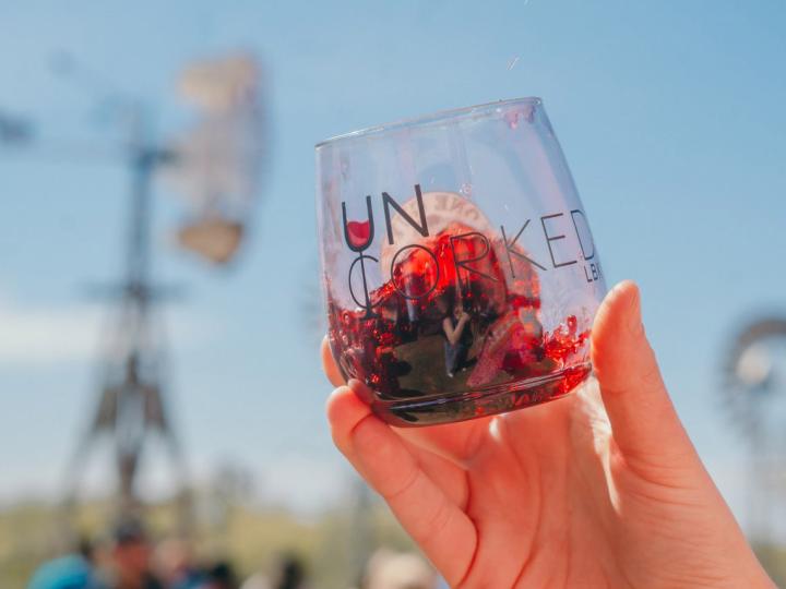 Showing off a wine glass from Lubbock Uncorked in Lubbock, Texas