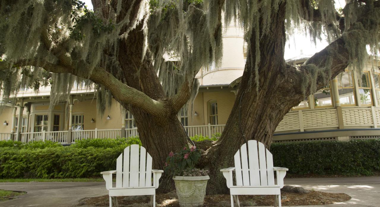 Patio chairs in front of Jekyll Island Victorian cottages in the Golden Isles, Georgia