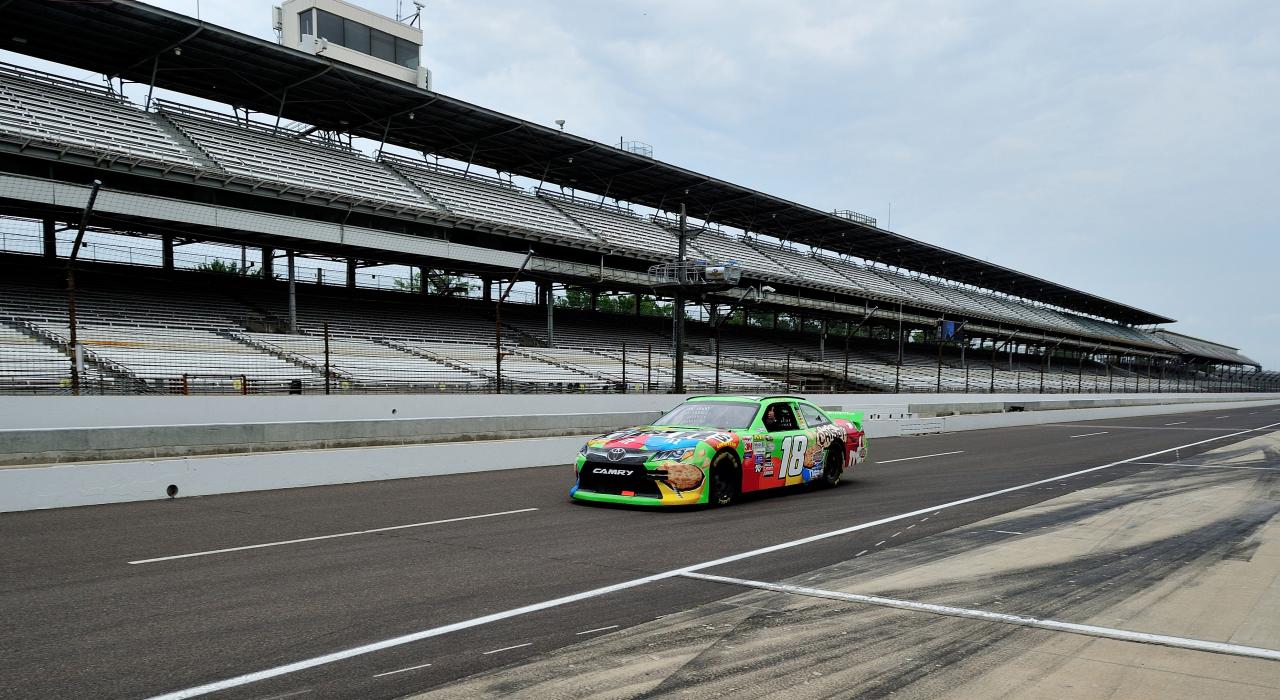 A racecar practices on the famous Indianapolis Motor Speedway