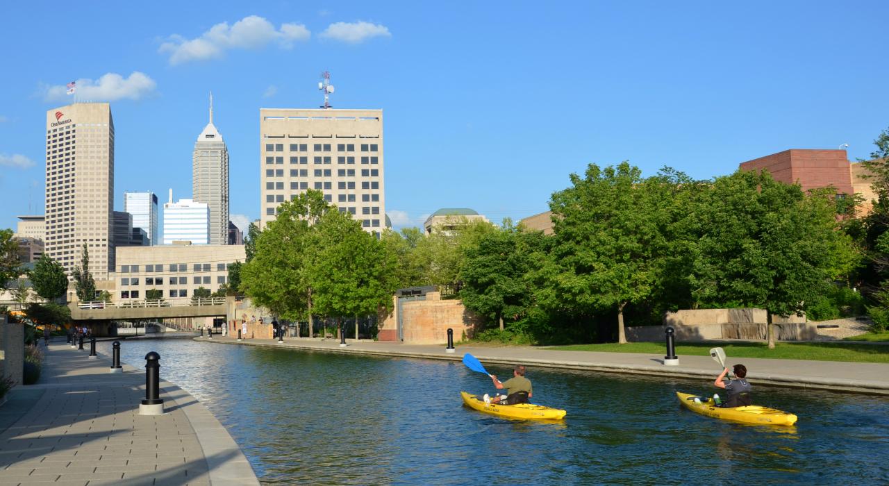 Kayakers paddle down Canal Walk downtown
