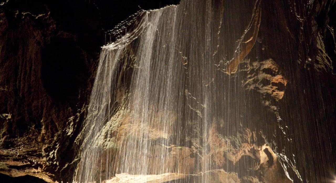 Formations and underground waterfall in Tuckaleechee Caverns