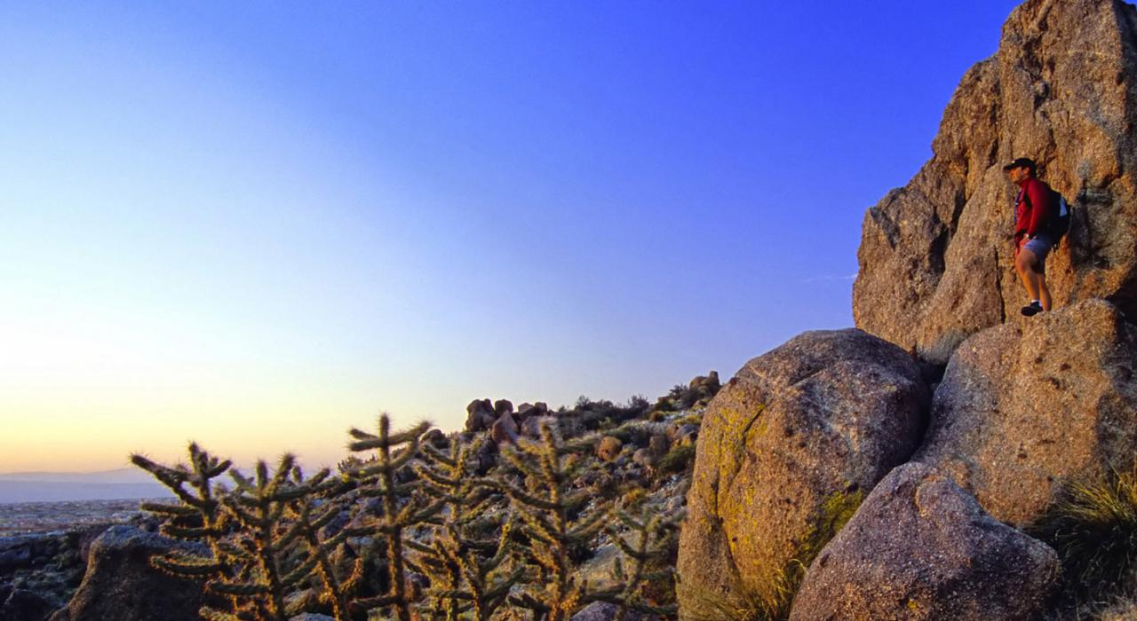 Admiring the breathtaking landscape while hiking at sunset