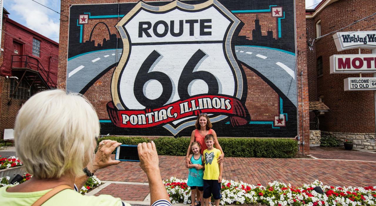 Posing in front of the classic Route 66 mural in Pontiac, Illinois