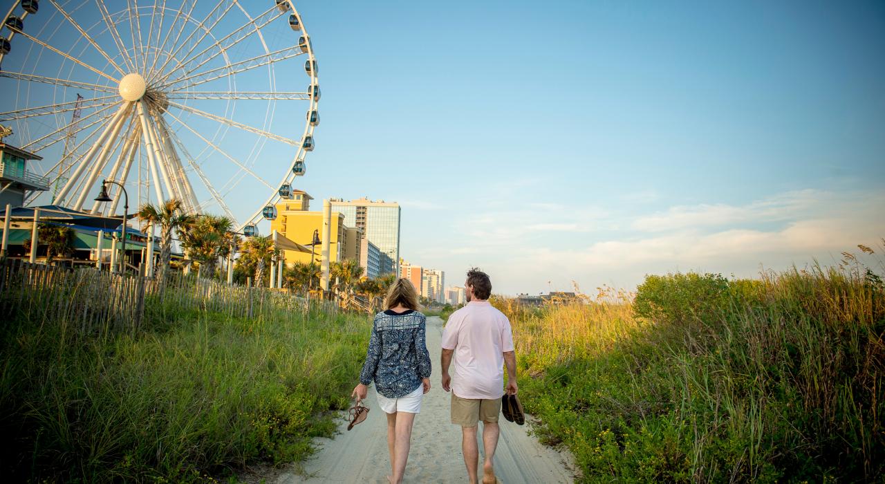 Walking the shores of Myrtle Beach, South Carolina, near the SkyWheel