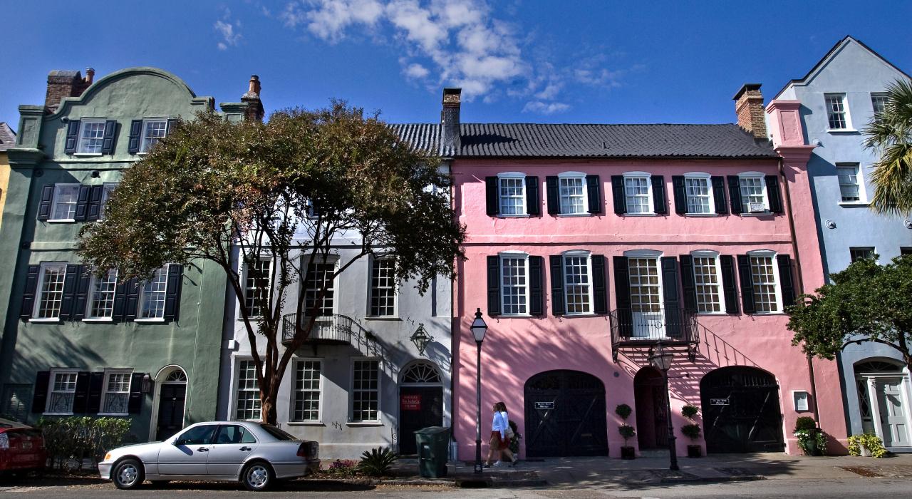 Strolling alongside the colorful houses known as ‘Rainbow Row’ in Charleston, South Carolina