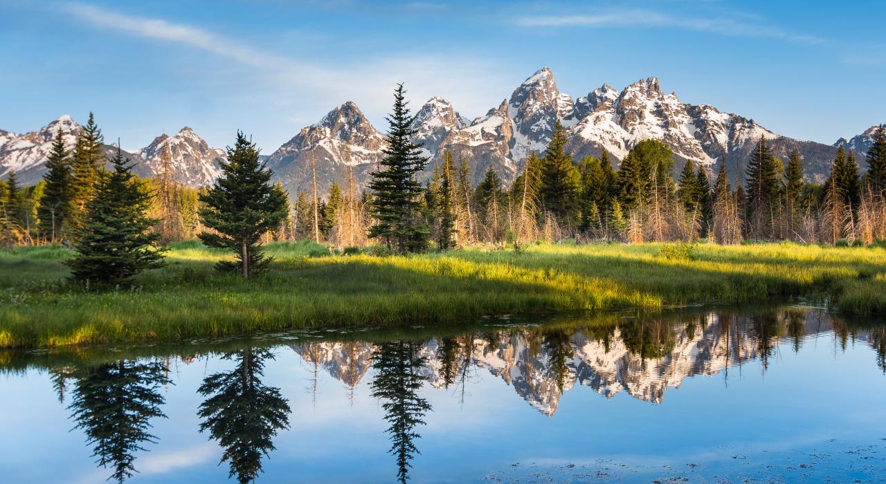 The majestic mountains reflecting in a waterway at Grand Teton National Park, Wyoming