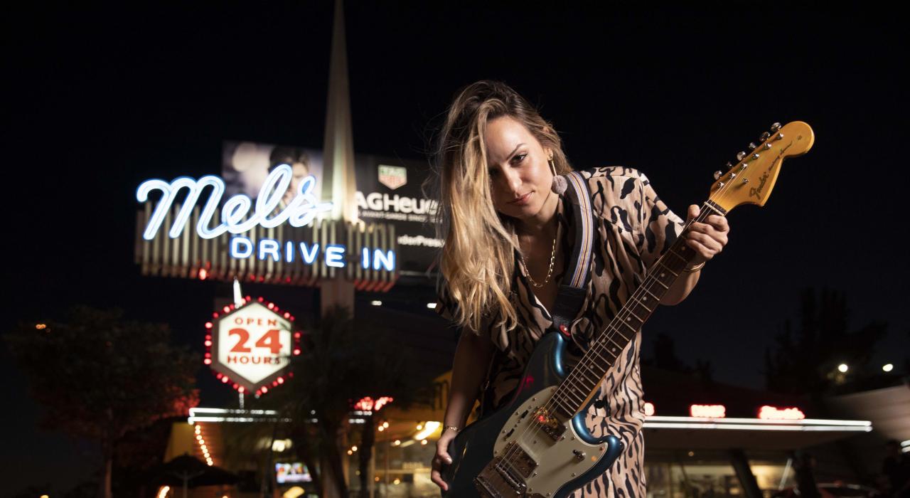 Rock musician Kat Meoz poses in front of Mel’s Drive-In in West Hollywood, California