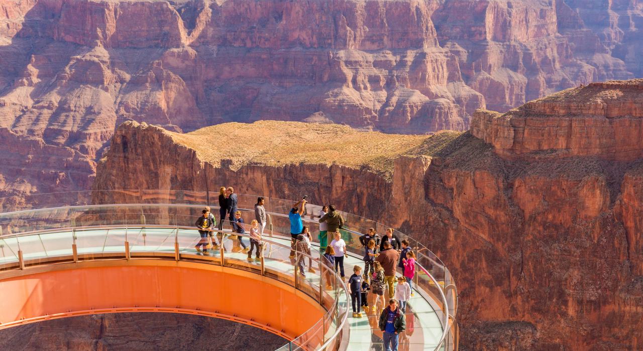 Visitors taking in the awesome views from the glass-bottomed Grand Canyon Skywalk