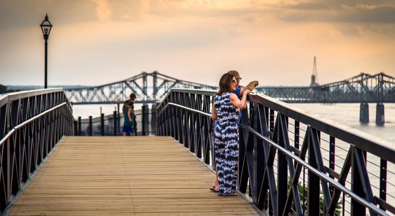 Couple taking in the view from the Bridge of Sighs on the city’s riverfront