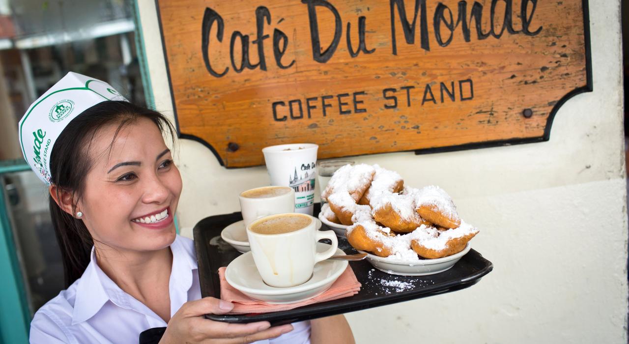 Serving coffee and beignets at Café du Monde