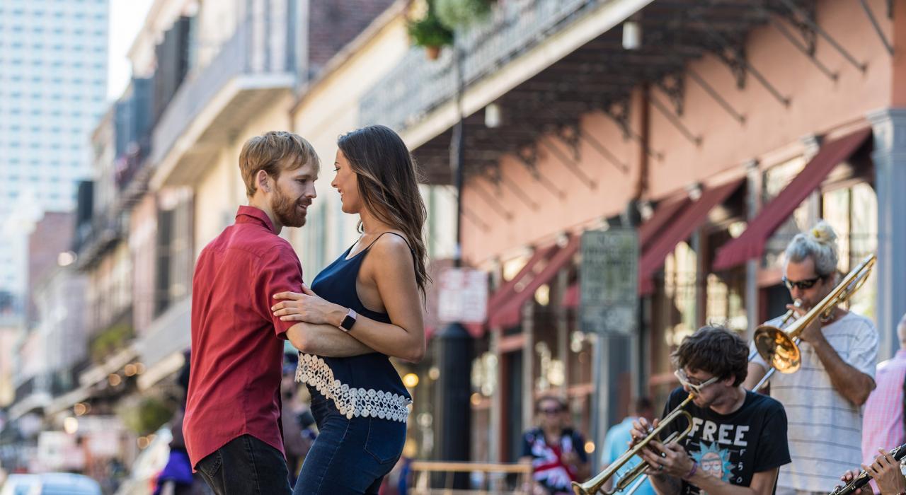 Dancing to live music performed by street musicians on Royal Street