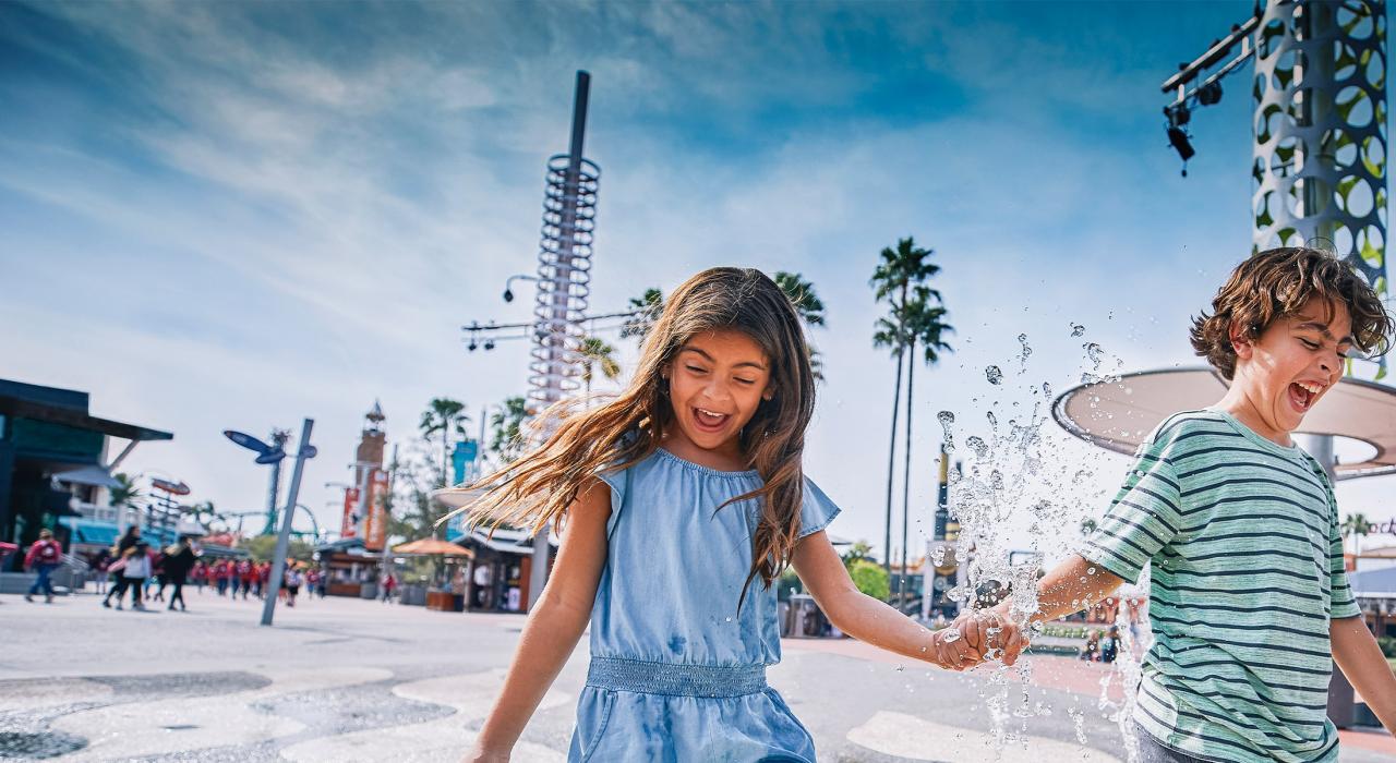 All smiles while playing on a splash pad at Universal CityWalk
