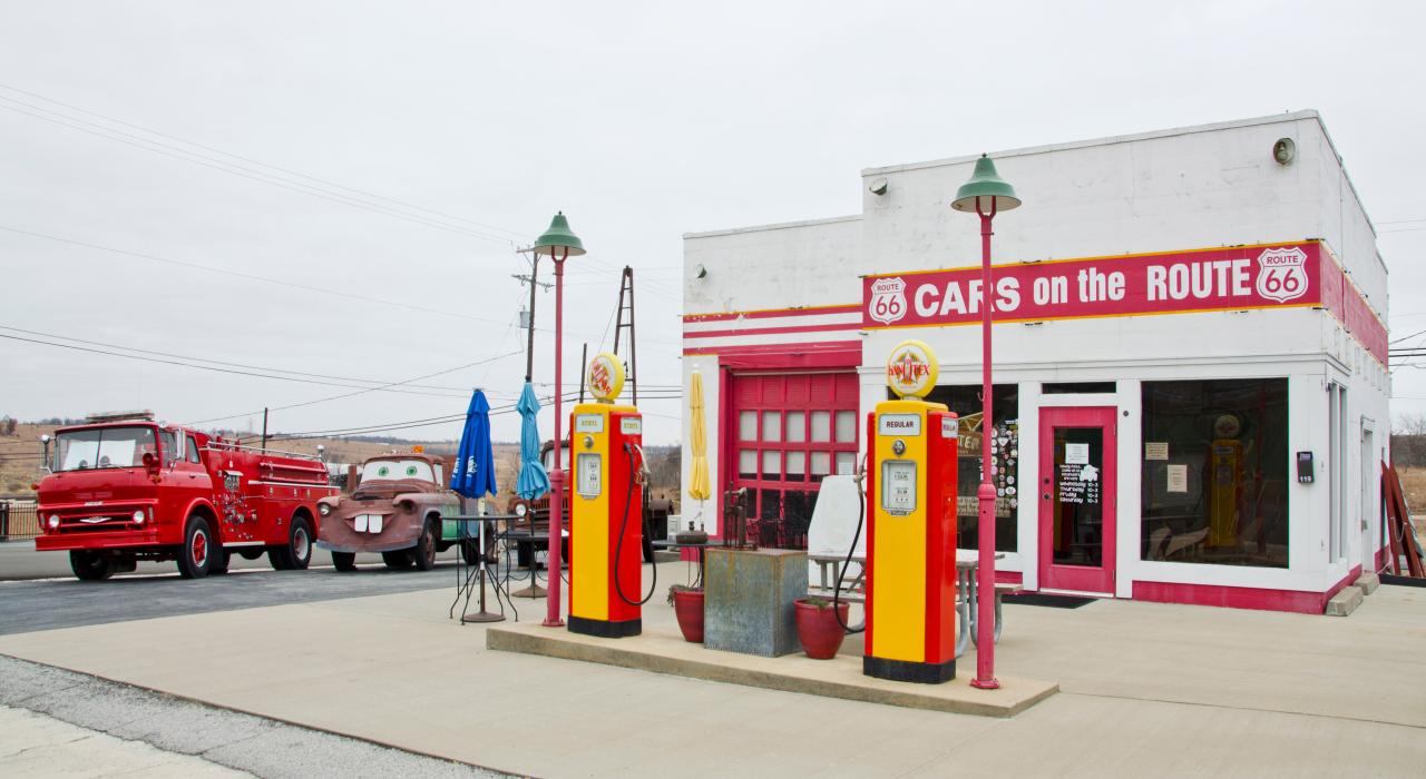 Service station and car garage painted white with red doors and trim known as Cars on the Route in Galena, Kansas