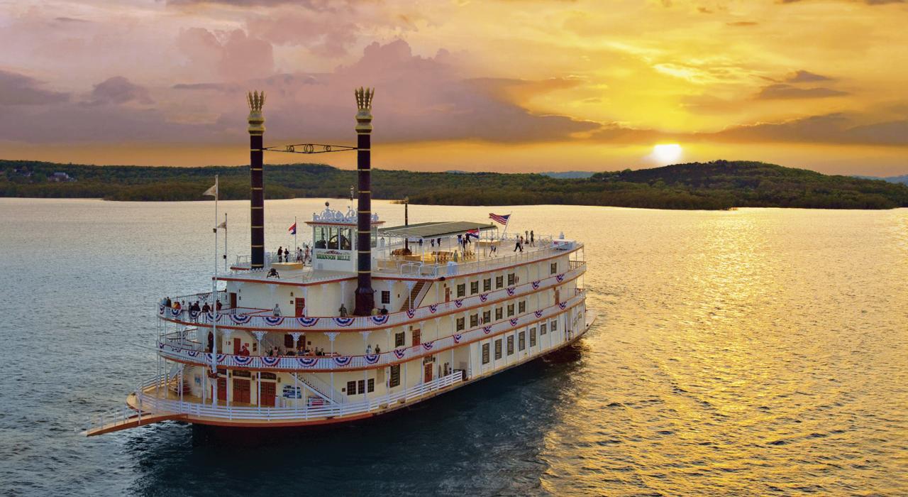 Showboat Branson Belle glides across Table Rock Lake at sunset