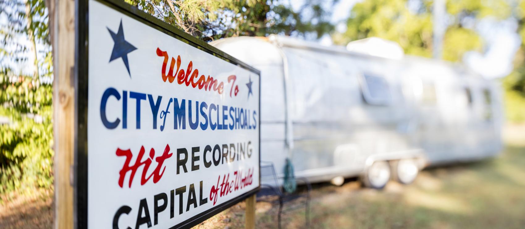 A sign welcoming visitors to Muscle Shoals, known as the ‘Hit Recording Capital of the World’