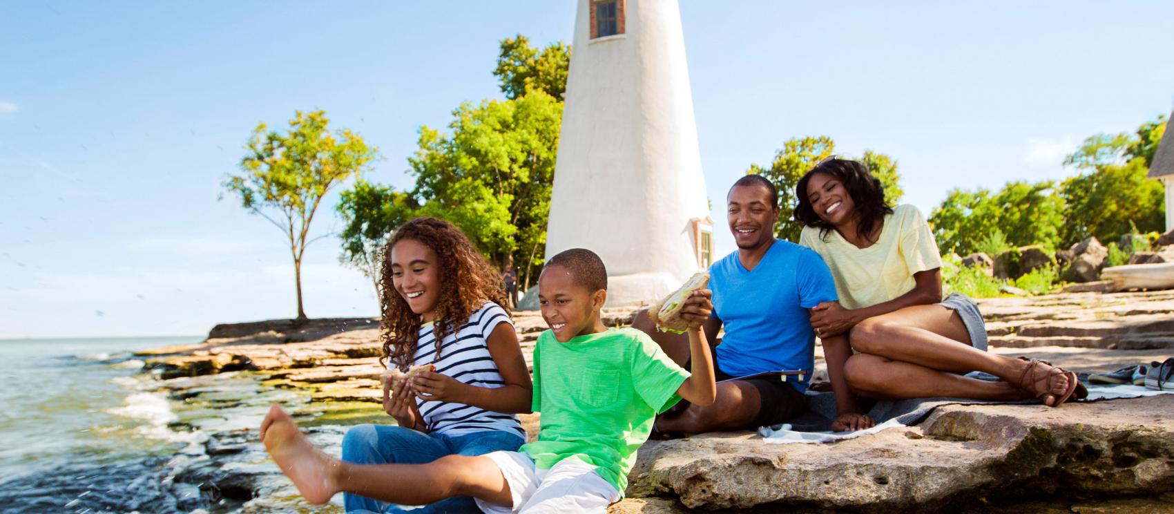 Family picnic at Marblehead Lighthouse State Park on the shores of Lake Erie