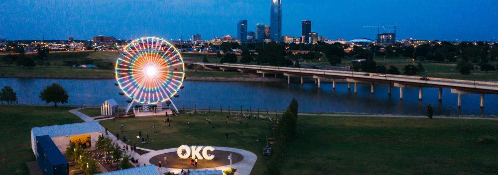 Lights of the Wheeler Ferris Wheel overlooking the Oklahoma River and downtown Oklahoma City Lights of the Wheeler Ferris Wheel overlooking the Oklahoma River and downtown Oklahoma City